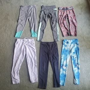 Six pairs of size 8 leggings